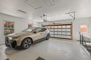Garage featuring baseboards
