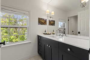 Bathroom featuring vanity and light tile patterned floors