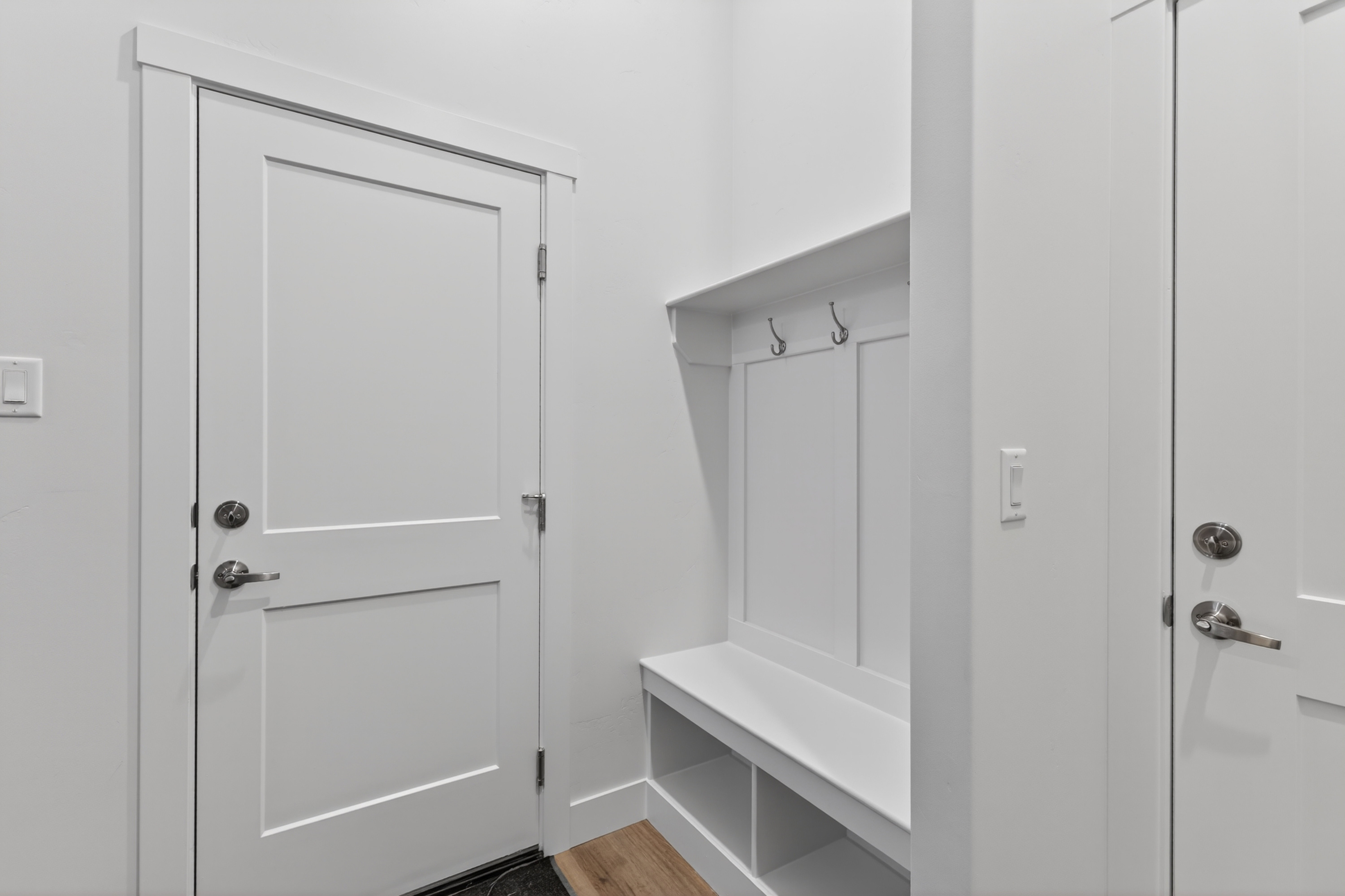 Mudroom with light wood finished floors