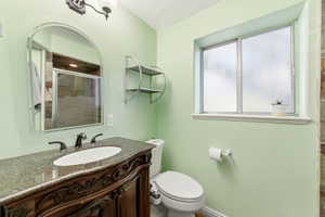 Bathroom with vanity and a shower stall
