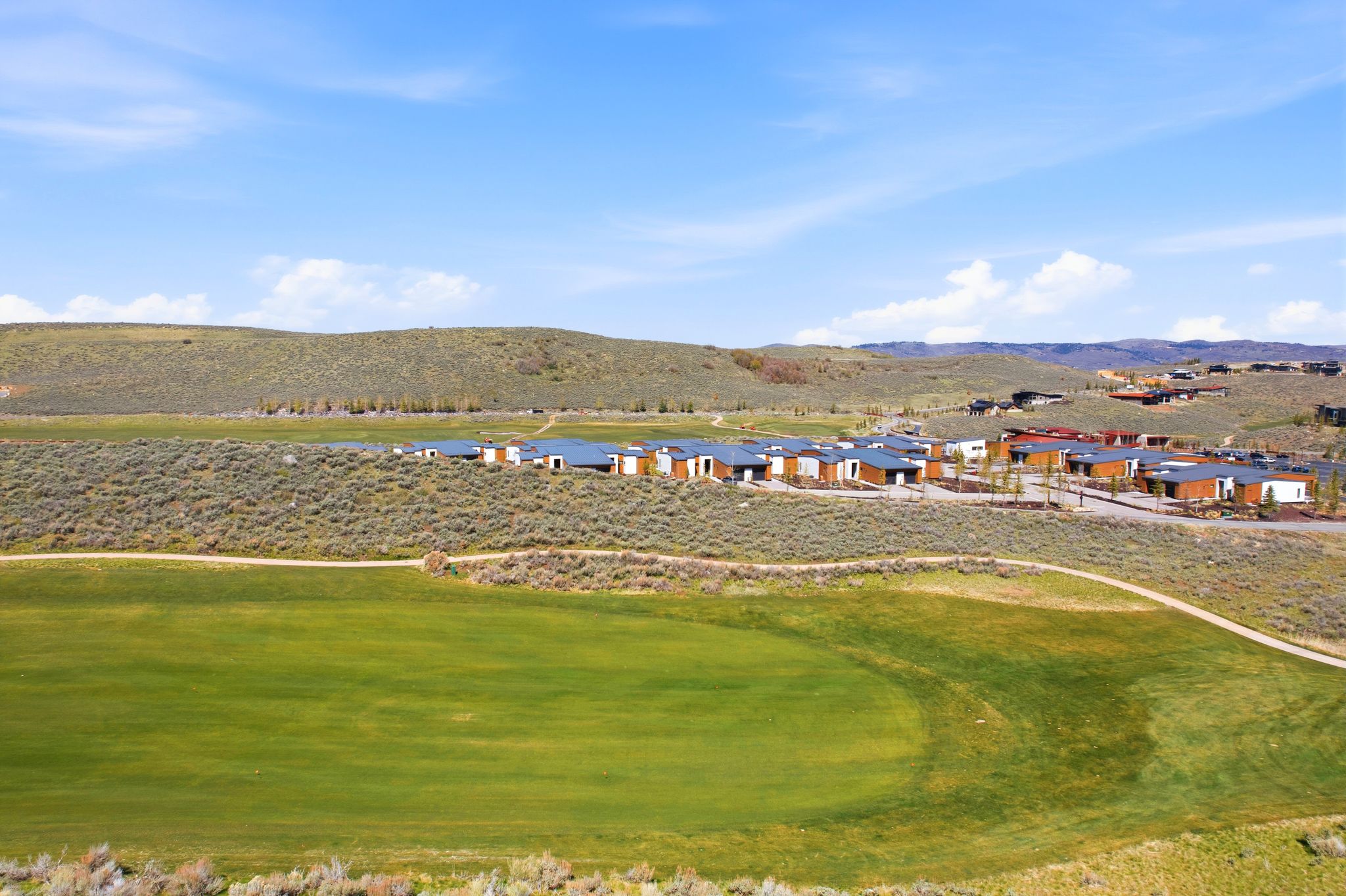 Surrounding community with a mountain view and view of golf course