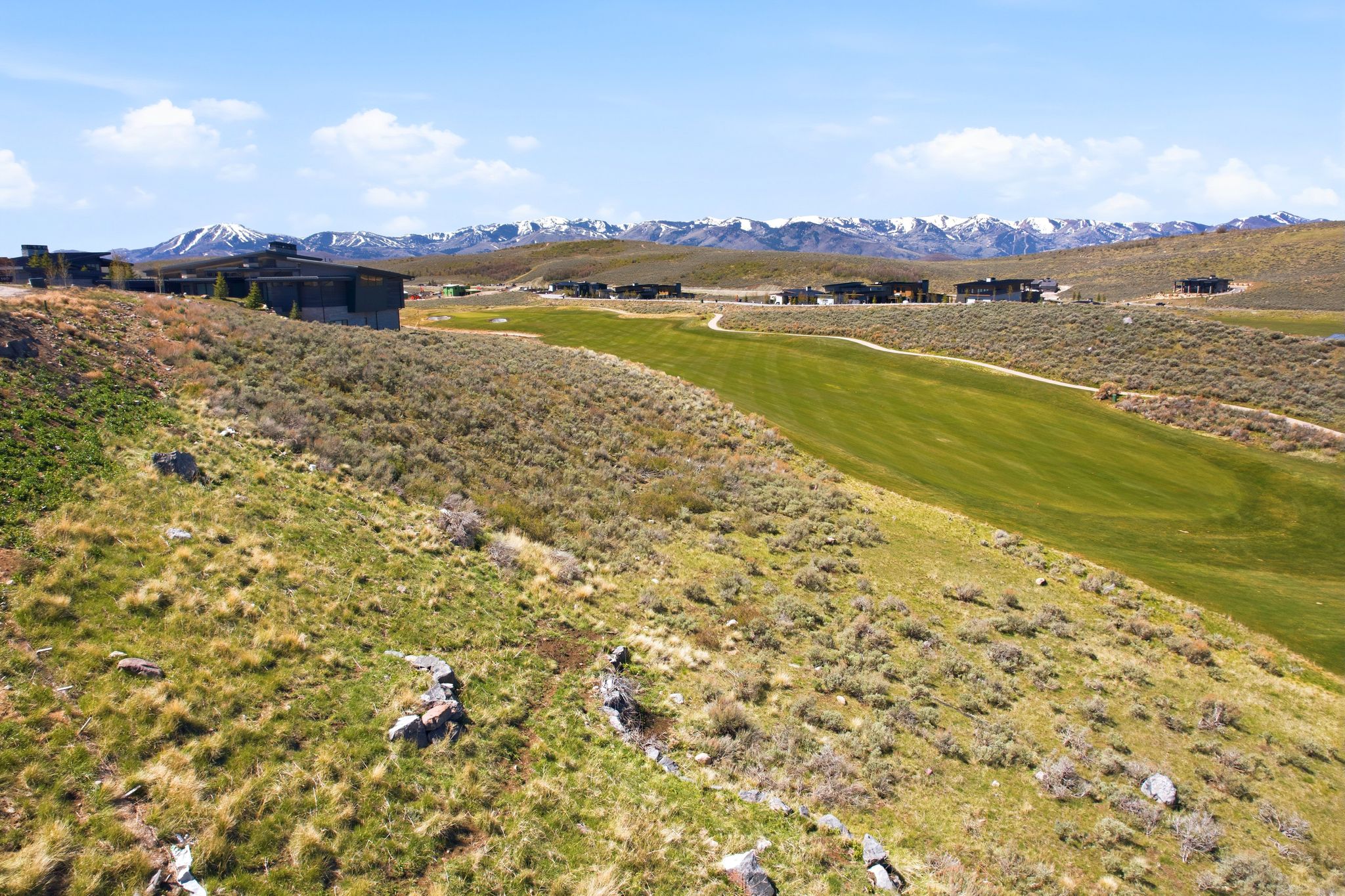 View of mountain backdrop with a local golf course