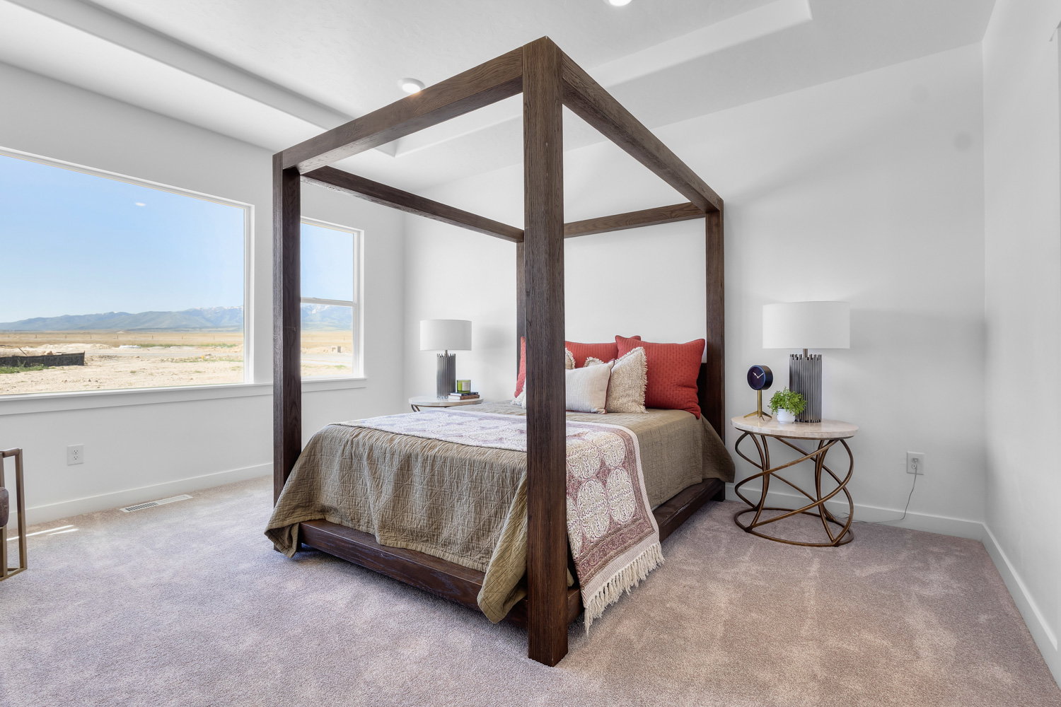 Carpeted bedroom featuring a mountain view and baseboards
