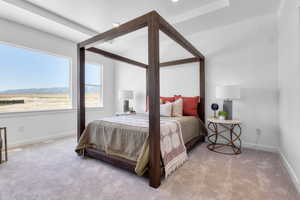 Carpeted bedroom featuring a mountain view and baseboards