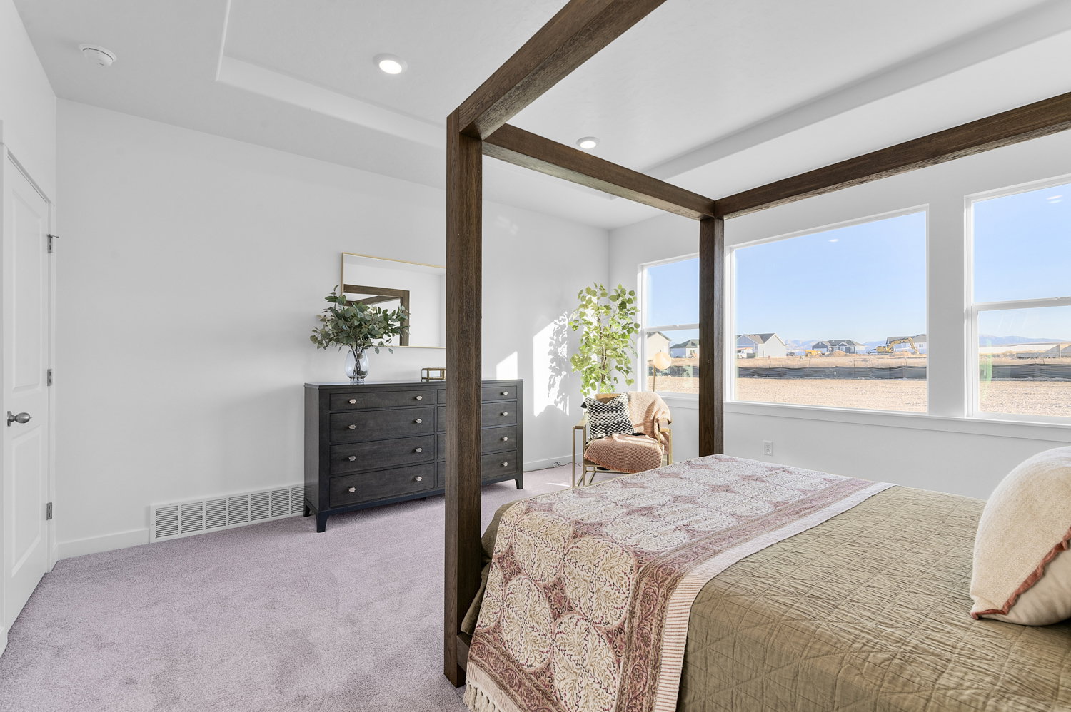 Bedroom with light carpet and recessed lighting