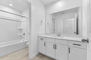 Full bathroom with vanity and shower / washtub combination