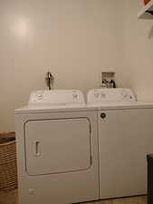 Laundry area with washing machine and clothes dryer