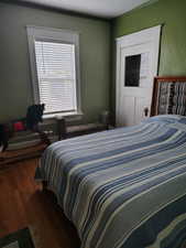 Bedroom with wood finished floors