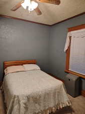 Bedroom feahttps://www.utahrealestate.com/lip.wizard/run/step/2/hbid/5385880#turing ornamental molding, ceiling fan, carpet flooring, and a textured ceiling