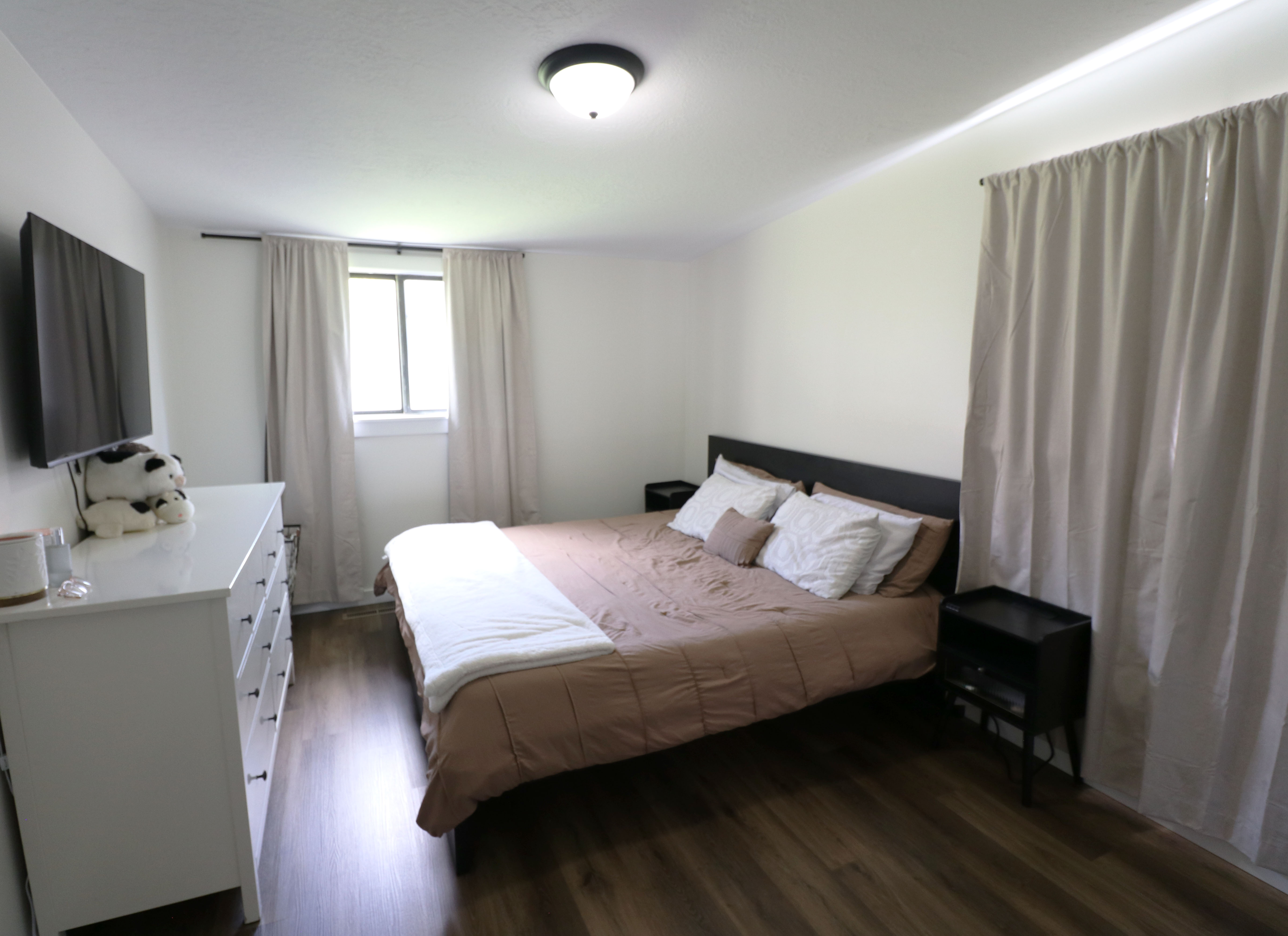 Bedroom featuring dark wood-style floors