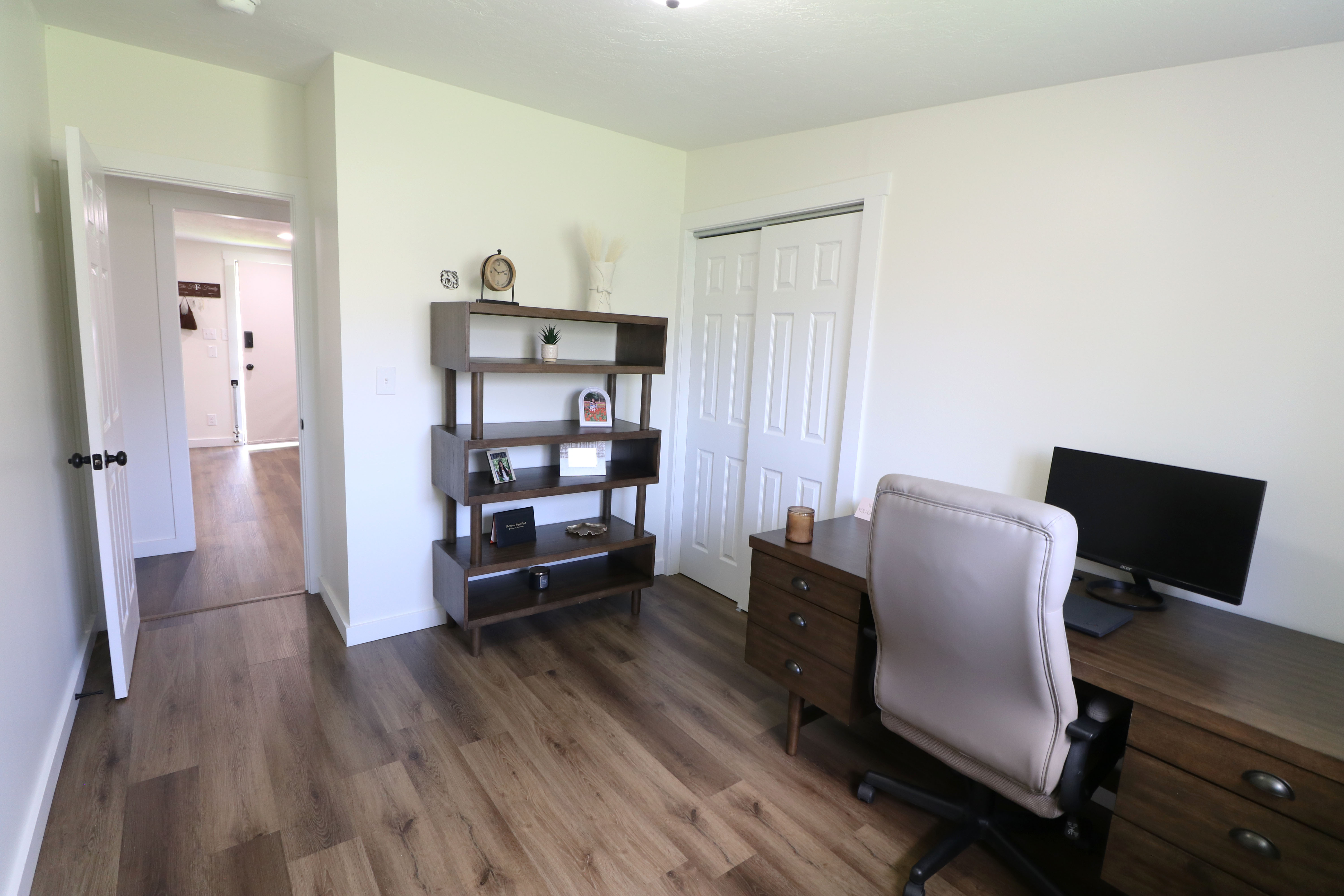 Office area with dark wood finished floors and baseboards