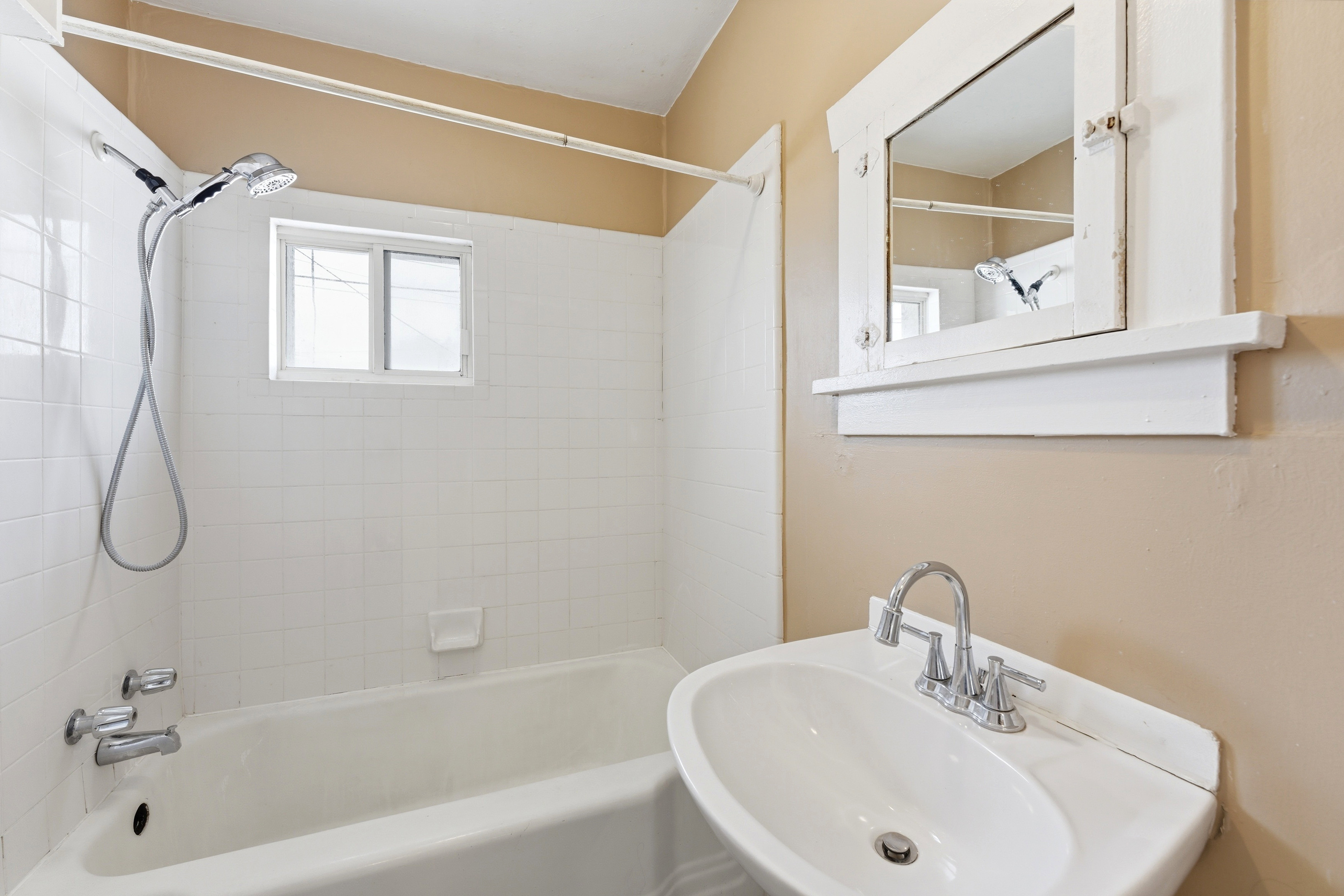 Bathroom featuring washtub / shower combination