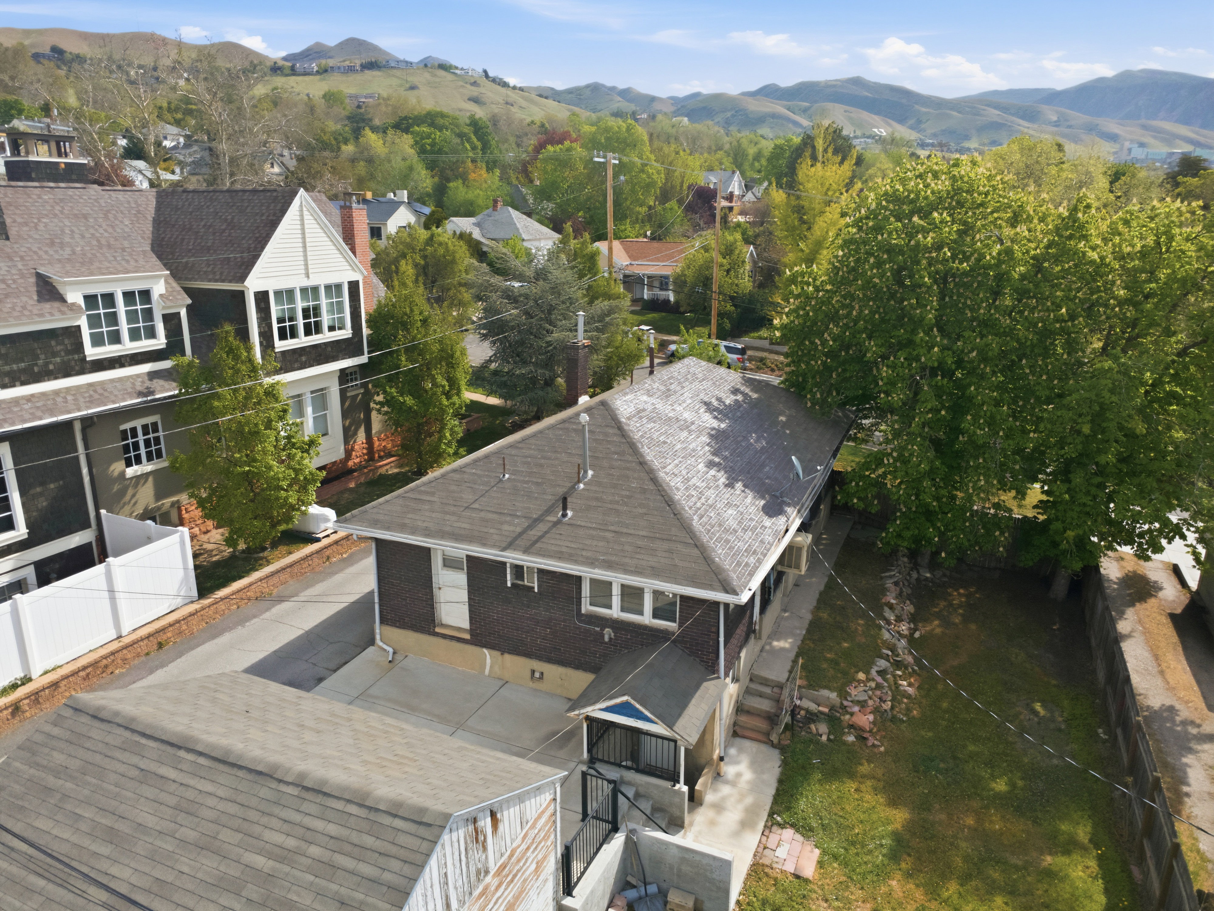 Aerial view of residential area featuring a mountainous background