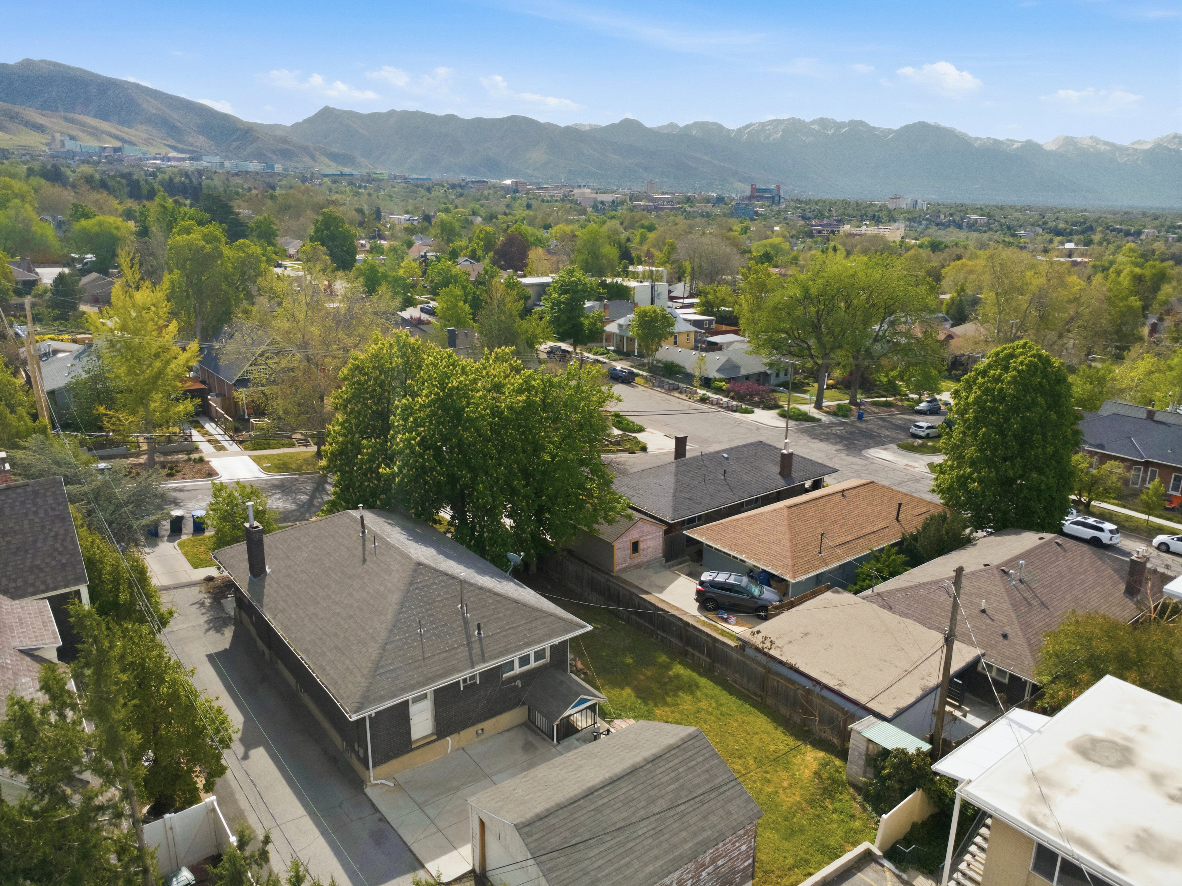 Aerial view of residential area featuring a mountain backdrop