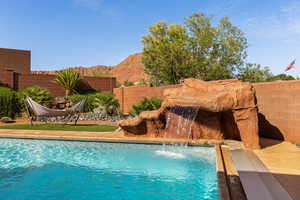 View of pool featuring a fenced backyard