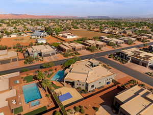 Aerial view of residential area with mountains and a pool