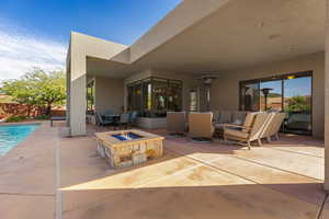 View of patio / terrace featuring outdoor lounge area and a fire pit