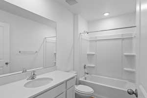 Full bath with vanity and shower / washtub combination