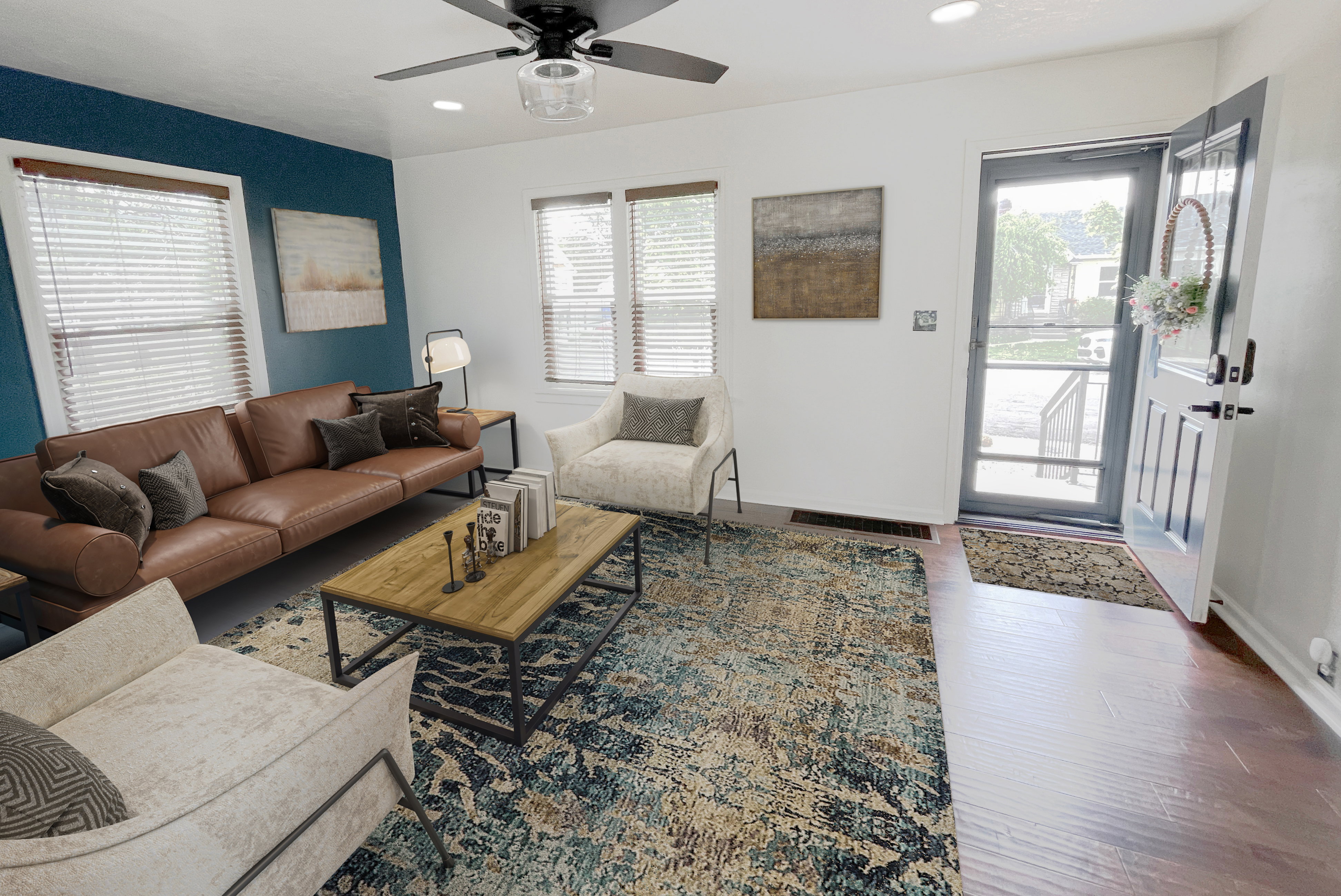 Spacious living area featuring wood-finish flooring, a ceiling fan with light fixture, and recessed lighting