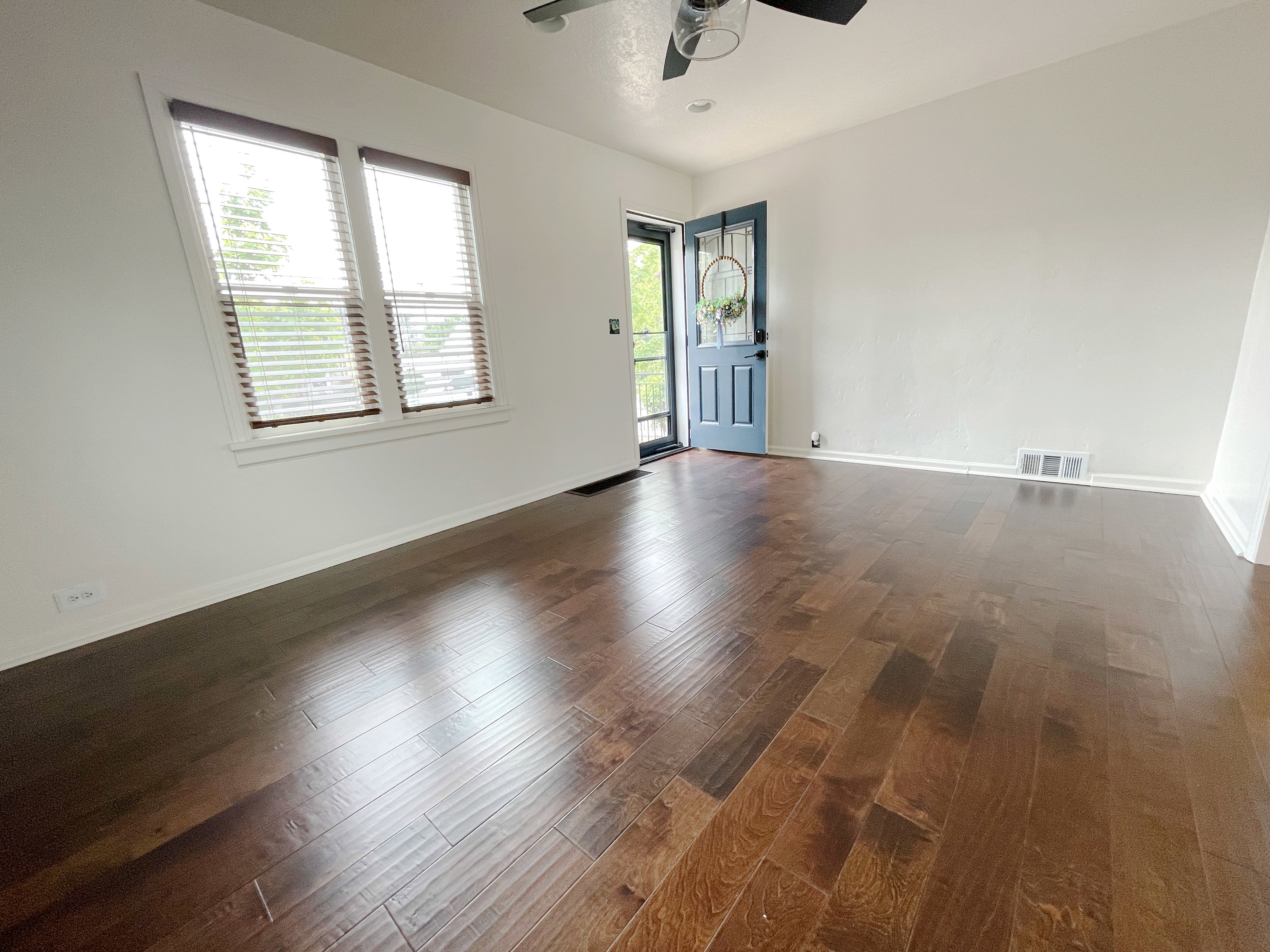 Spacious interior featuring rich wood-finish flooring