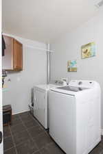 Laundry area with washing machine and dryer and cabinet space