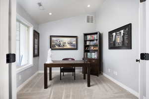 Office area with light carpet, vaulted ceiling, and recessed lighting
