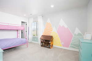 Bedroom featuring light colored carpet and recessed lighting