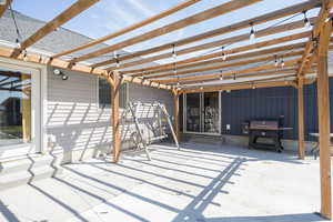 View of patio / terrace featuring a pergola, a grill, and entry steps