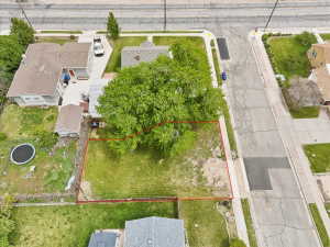 Aerial perspective of suburban area with property parcel outlined
