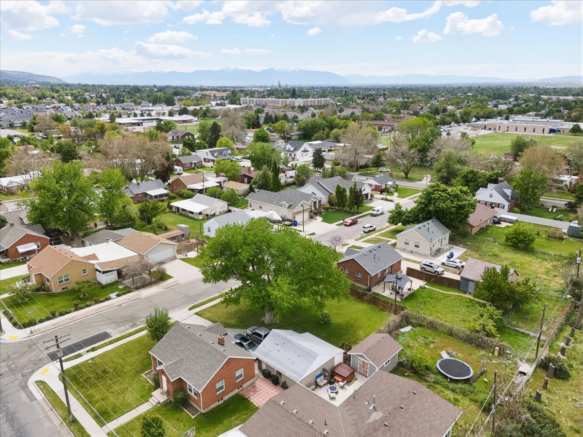 Aerial perspective of suburban area with a mountainous background