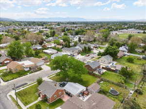 Aerial perspective of suburban area with a mountainous background