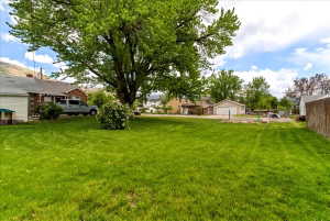 View of grassy yard with a residential view