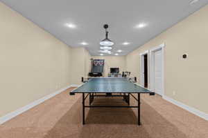 Playroom with carpet floors and recessed lighting