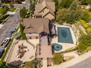 Aerial view of property and surrounding area featuring a pool