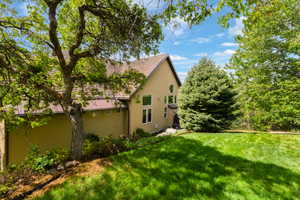 View of property exterior with stucco siding