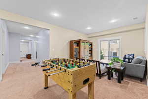 Rec room featuring light carpet and recessed lighting