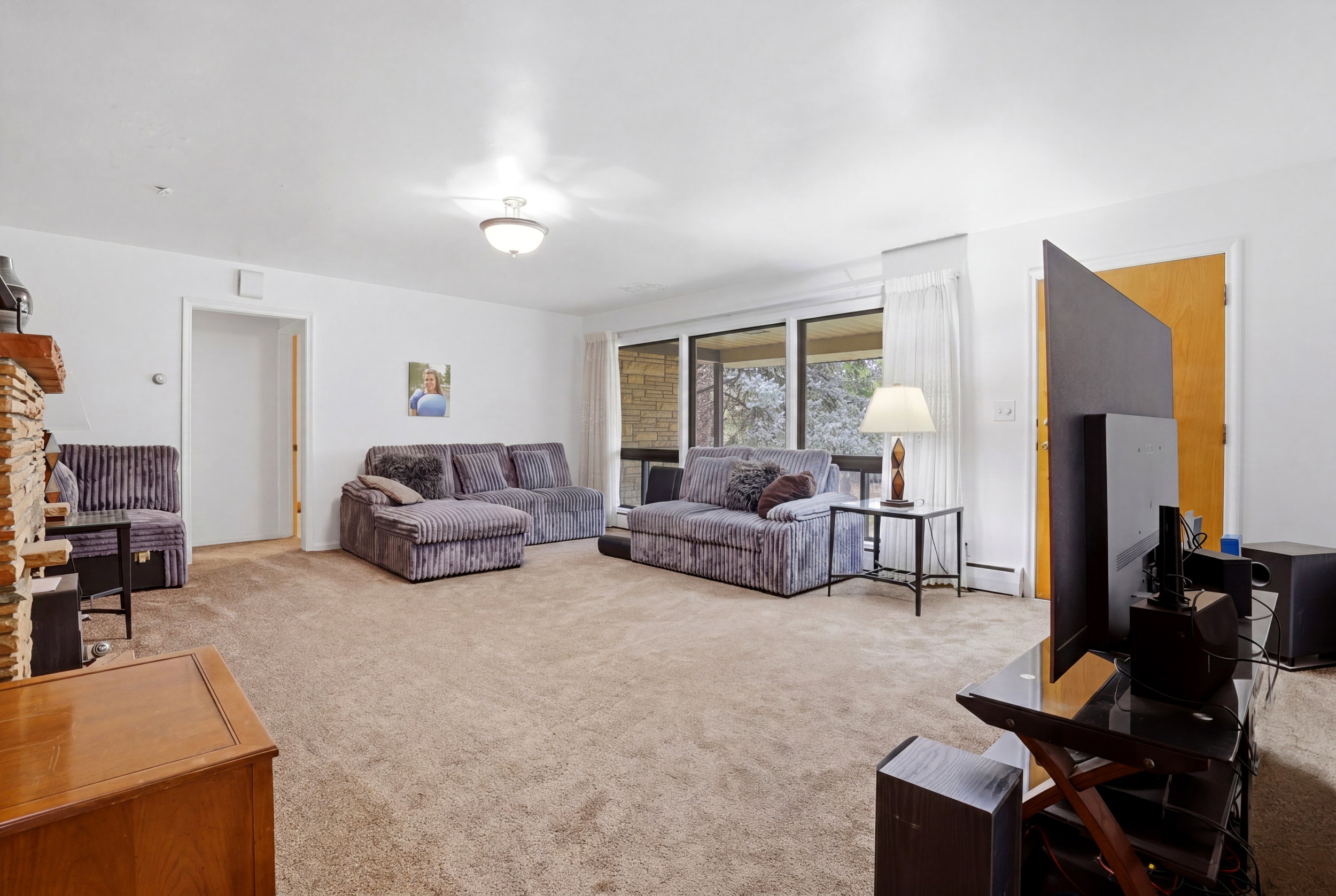 Living area with light colored carpet