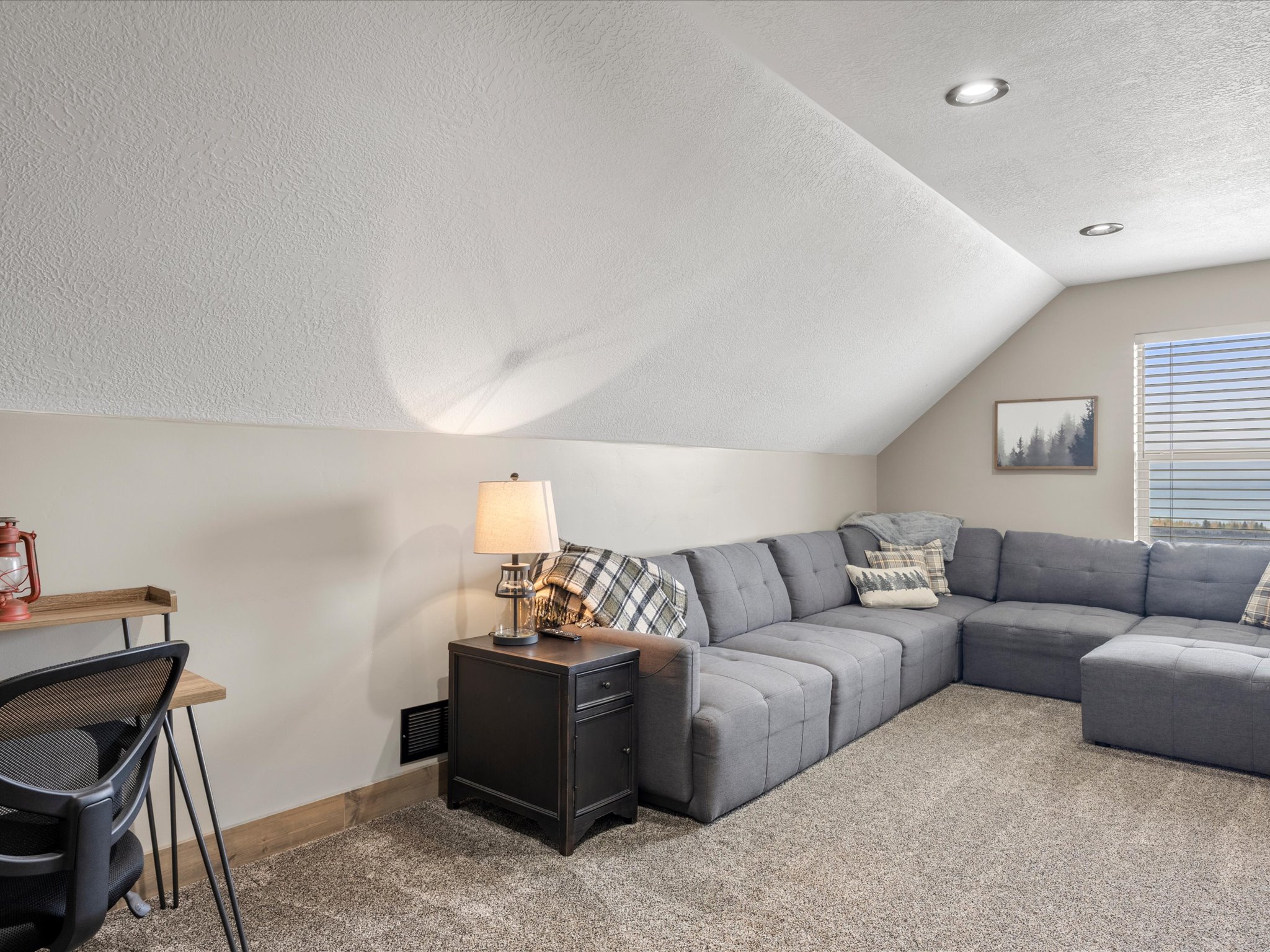 Living area with carpet flooring and baseboards