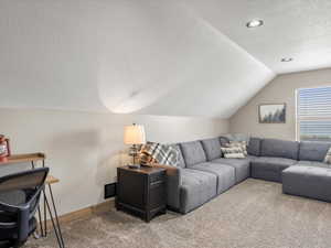 Living area with carpet flooring and baseboards