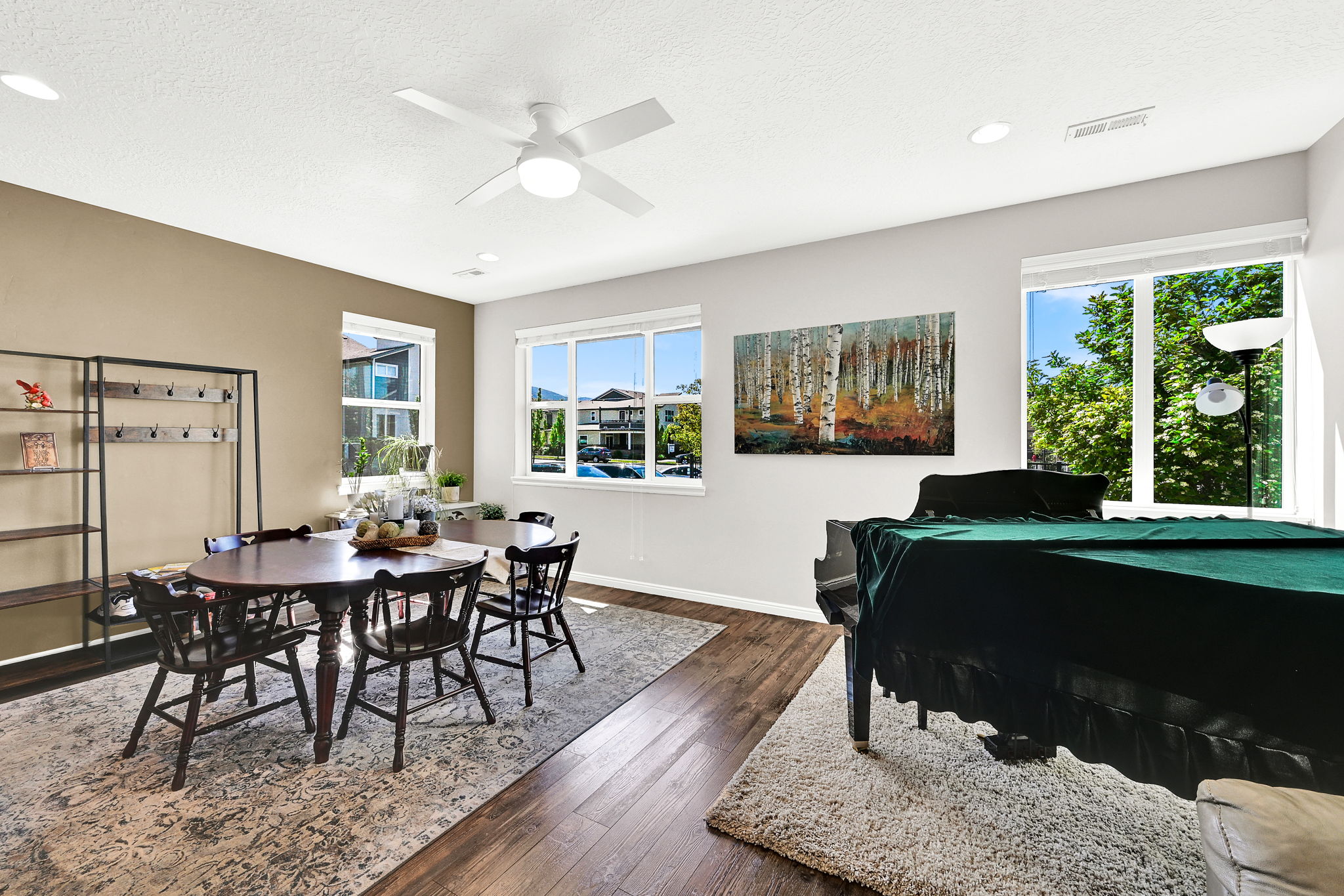 Another view of this multifunctional great room. Showing the healthy amount of natural light.