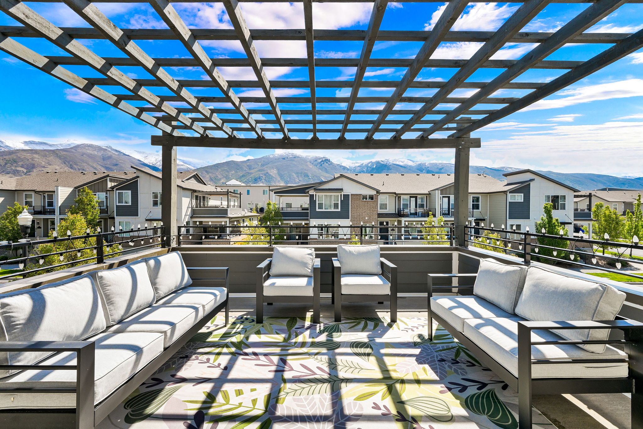 View of patio / terrace with outdoor lounge area, a mountain view, a residential view, and a pergola