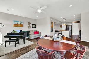 A additional view of this wonderful great room space and all it has to offer with the kitchen in the background.