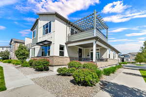 Front of Home faces the pool with large porch area, under the wonderful 2nd story deck