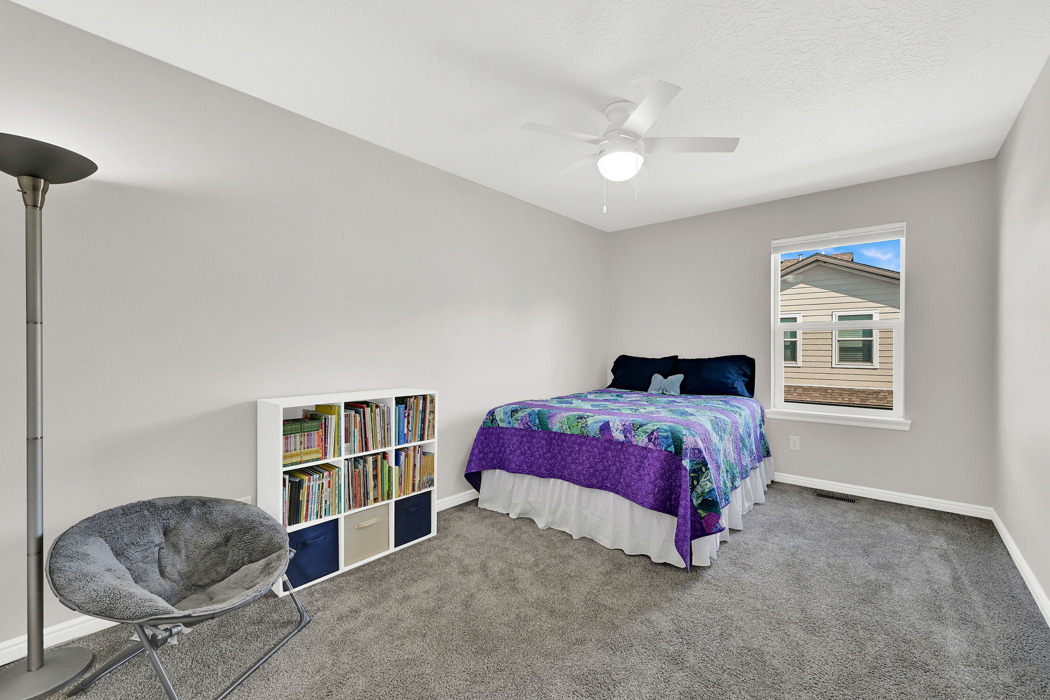 1st Bedroom with carpet flooring and a ceiling fan