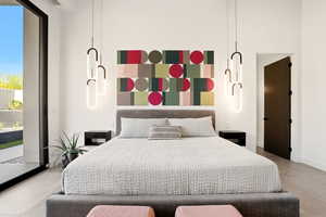 Bedroom featuring access to outside and concrete floors