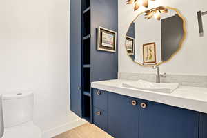 Half bath with vanity and toilet