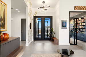 Foyer featuring french doors, recessed lighting, and plenty of natural light