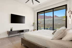 Bedroom featuring access to exterior and ceiling fan