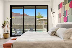 Bedroom with access to exterior and a mountain view