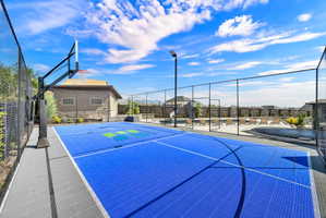 View of basketball court featuring a patio area and community basketball court